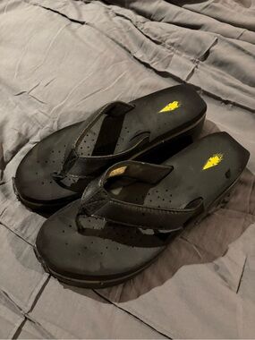 Volatile Black Leather Platform Flip Flop Sandals with Yellow Accent